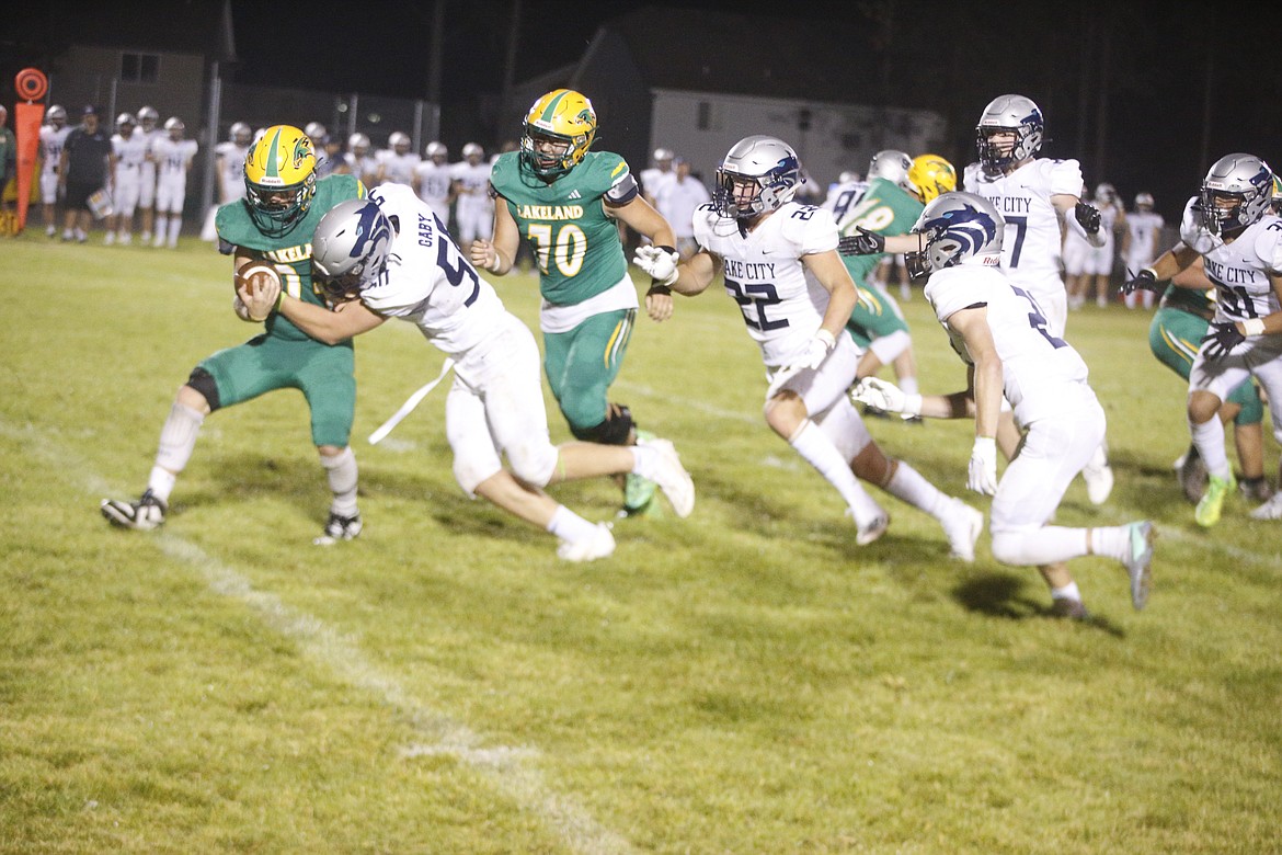 JASON ELLIOTT/Press
Lakeland tailback Lovie Weil is tackled by Lake City linebacker Harmon Gaby during their 2023 football game at Corbit Field in Rathdrum. The teams will meet on Aug. 30 at 7 p.m. at Lake City High.