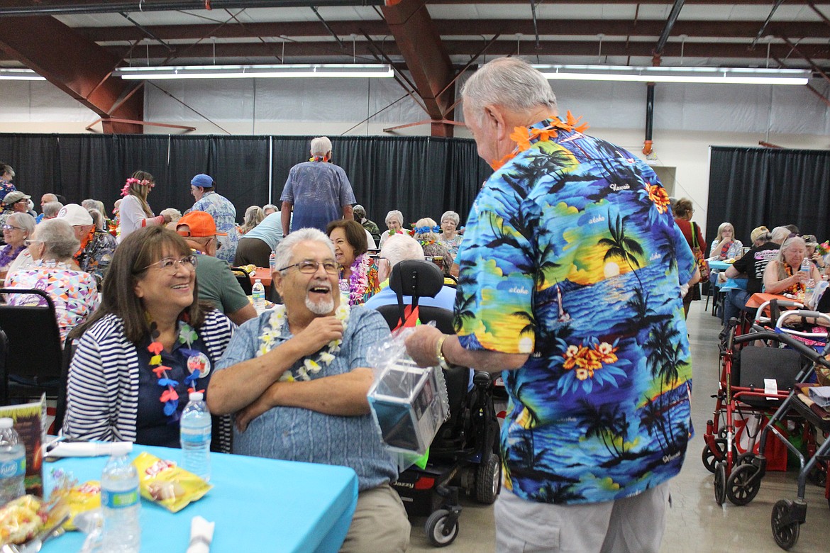 Tropical shirts and conversations with friends were the order of the day at the annual Senior Picnic Wednesday.