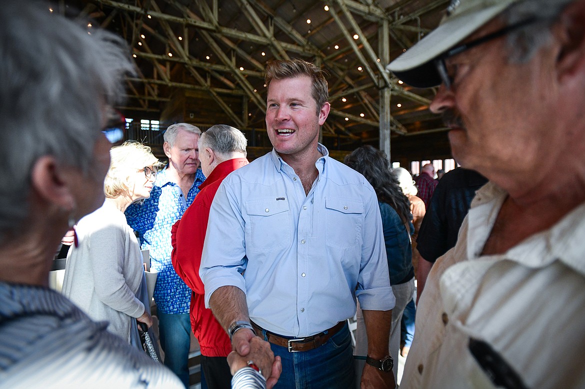 Republican U.S. Senate candidate Tim Sheehy speaks with attendees after a Save America Rally with former congresswoman and 2020 presidential candidate Tulsi Gabbard at Snowline Acres in Kalispell on Thursday, June 13. (Casey Kreider/Daily Inter Lake)