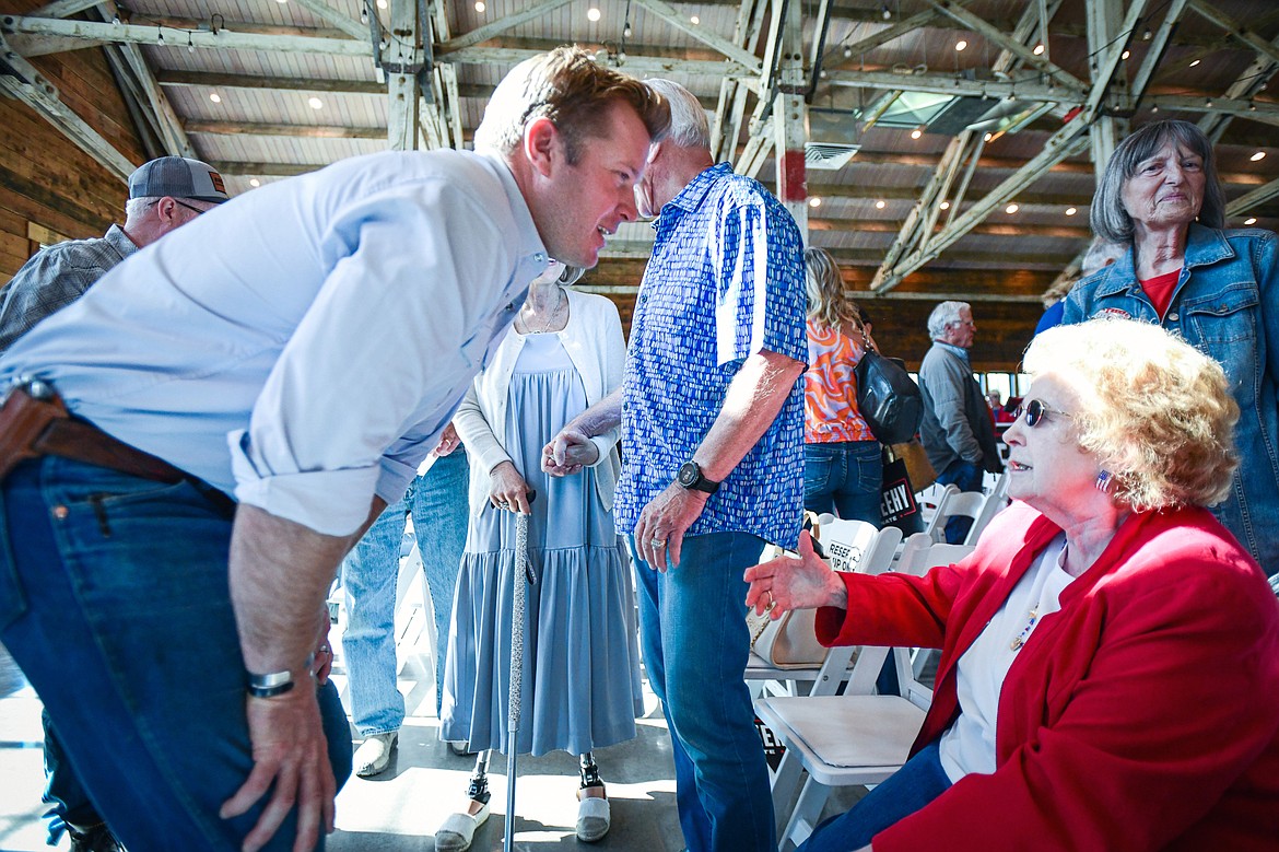 Republican U.S. Senate candidate Tim Sheehy speaks with Bigfork resident Frances Haden after a Save America Rally at Snowline Acres in Kalispell on Thursday, June 13. (Casey Kreider/Daily Inter Lake)