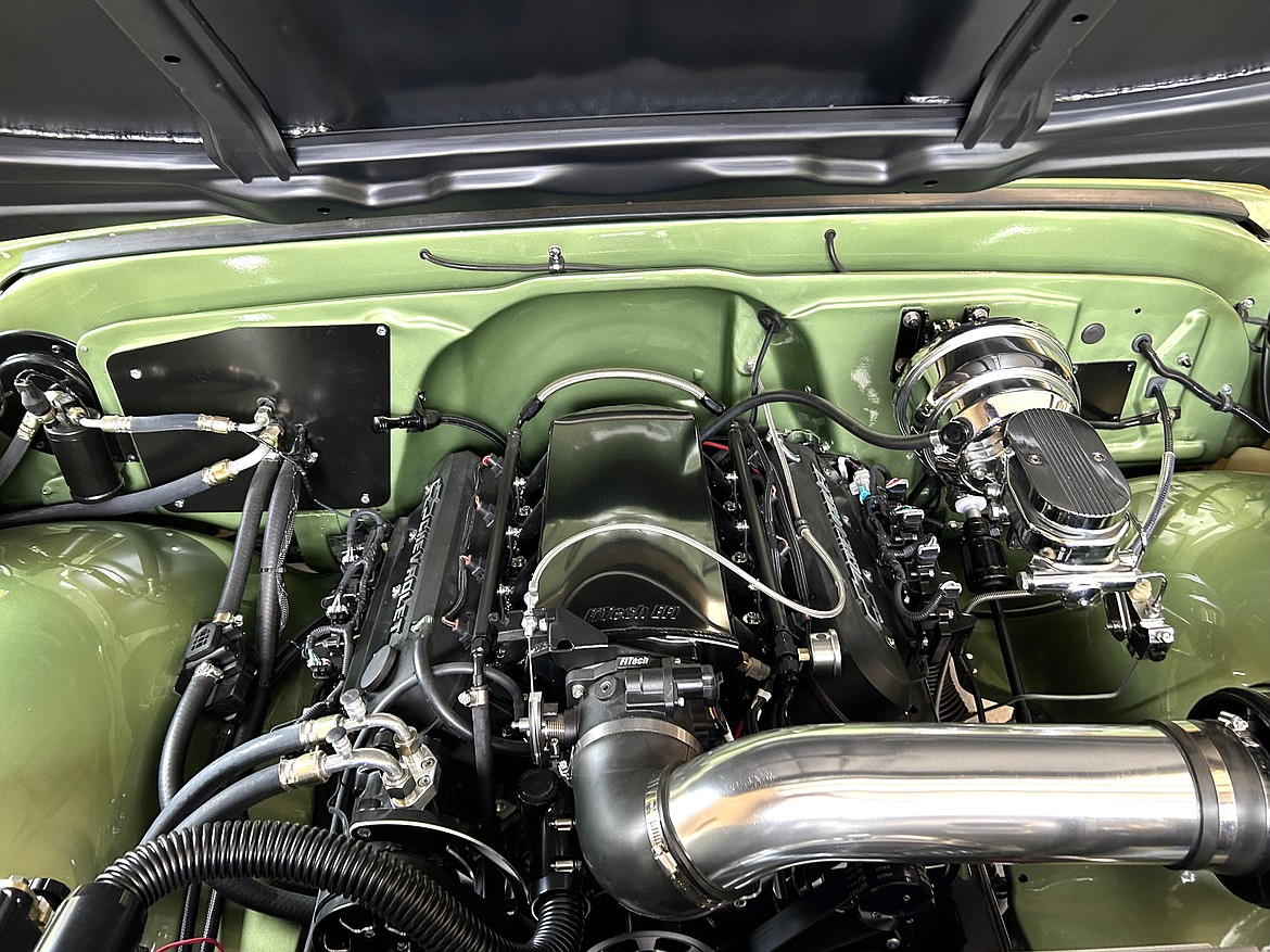 The glistening engine of one of Ken Murren's restored classics.