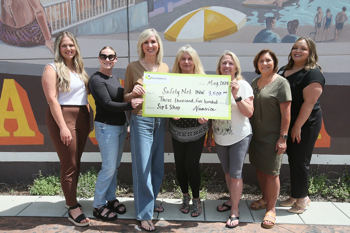 Numerica donated $3,500 to Safety Net Inland Northwest after partnering with 19 downtown Coeur d'Alene businesses for the Sip and Shop for Safety Net fundraiser held May 24-31. Pictured Thursday in Coeur d'Alene Rotary Centennial Park: Paige Lawson, Numerica; Hawley Gottschalk, Marie Widmyer, Kristen Neeser, Bobbi Bild and Paula Lyon, Safety Net; and Amanda Swan, Numerica.