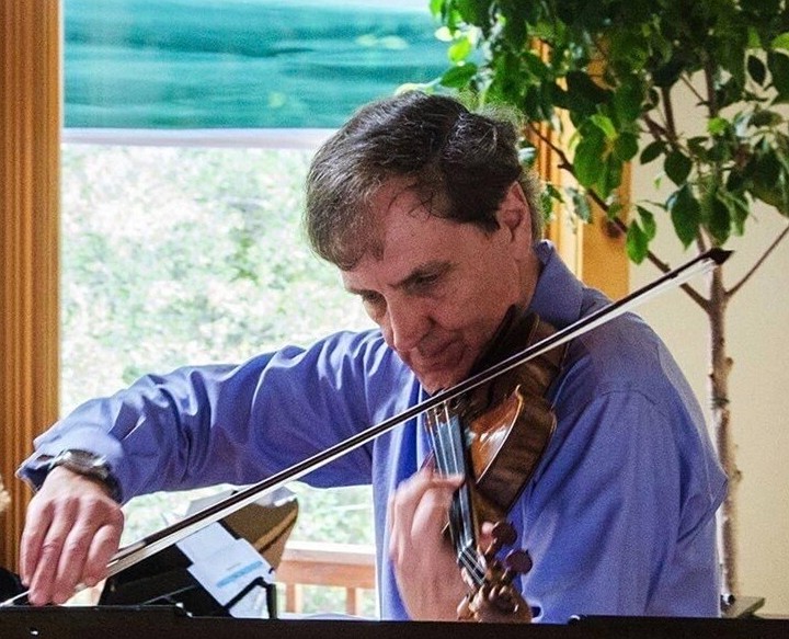 Richard Altenbach is seen with his violin during a performance four years ago.