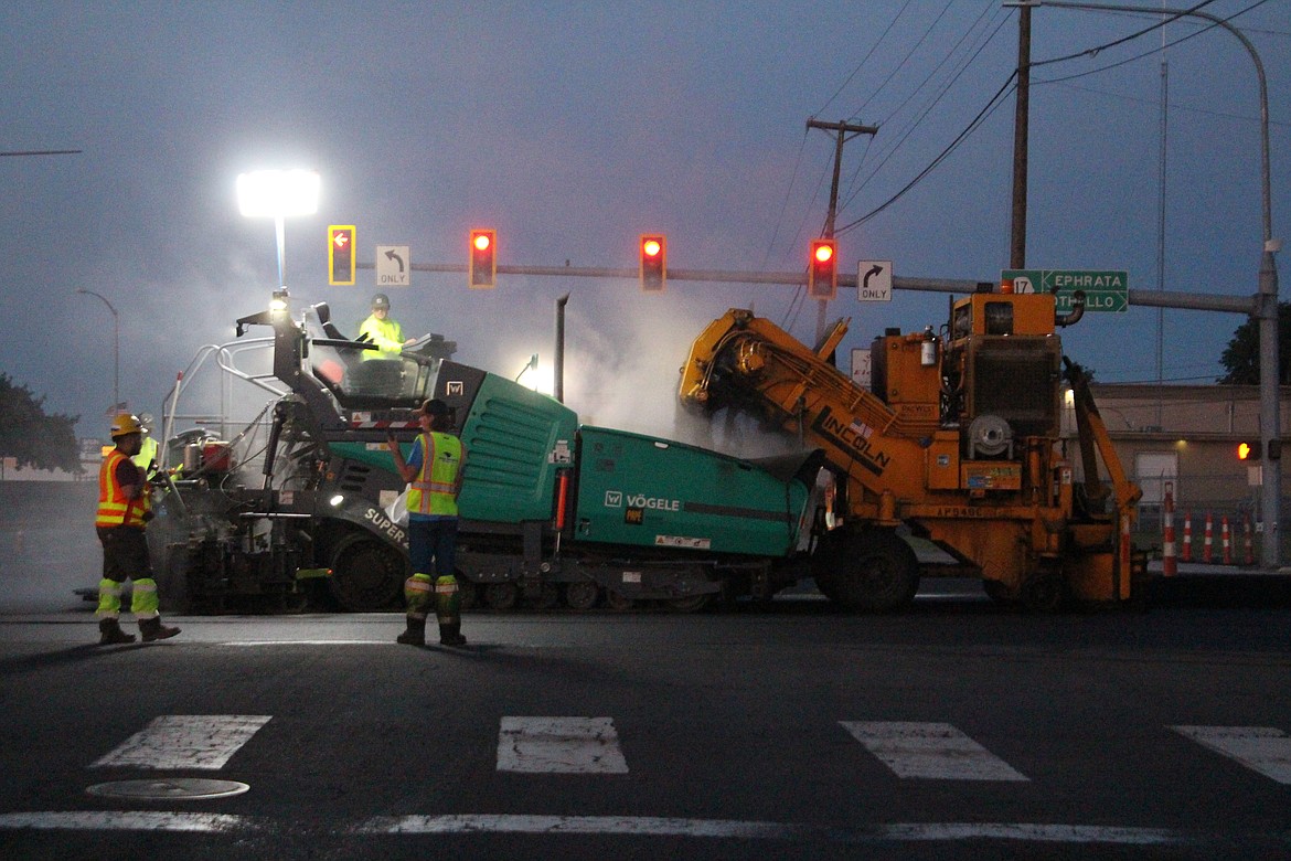 Construction crews lay down asphalt at the intersection of Wheeler Road and State Route 17 Wednesday. The project to resurface SR 17 is entering its closing stages.