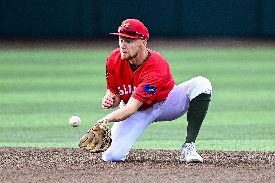 Glacier shortstop Andy Atwood (21) watches a low line drive into his glove for an out against the Idaho Falls Chukars at Glacier Bank Park on Friday, June 14. (Casey Kreider/Daily Inter Lake)