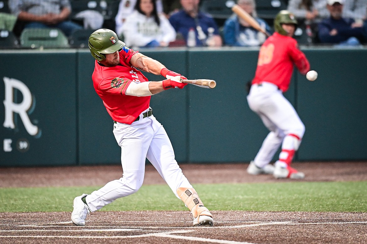 Glacier's Ajay Sczepkowski (24) connects on a single against the Idaho Falls Chukars at Glacier Bank Park on Friday, June 14. (Casey Kreider/Daily Inter Lake)