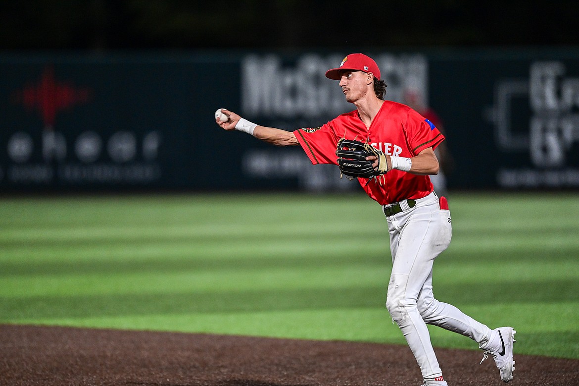 Glacier second baseman Mason Dinesen (23) throws to first for an out against the Idaho Falls Chukars at Glacier Bank Park on Friday, June 14. (Casey Kreider/Daily Inter Lake)