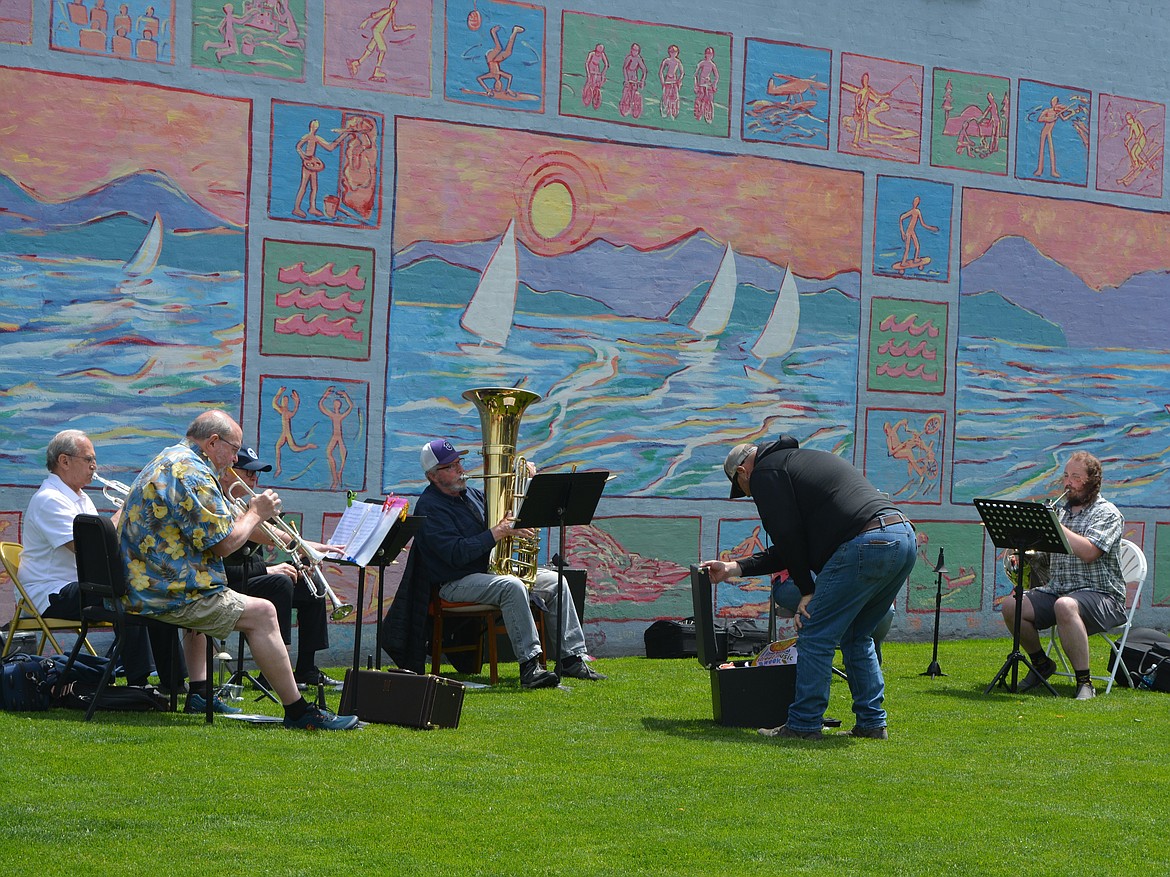 Brass sextet CdABrassX5 performed Friday afternoon on the grass at 2nd St. and Sherman Ave. as part of Street Music Week.