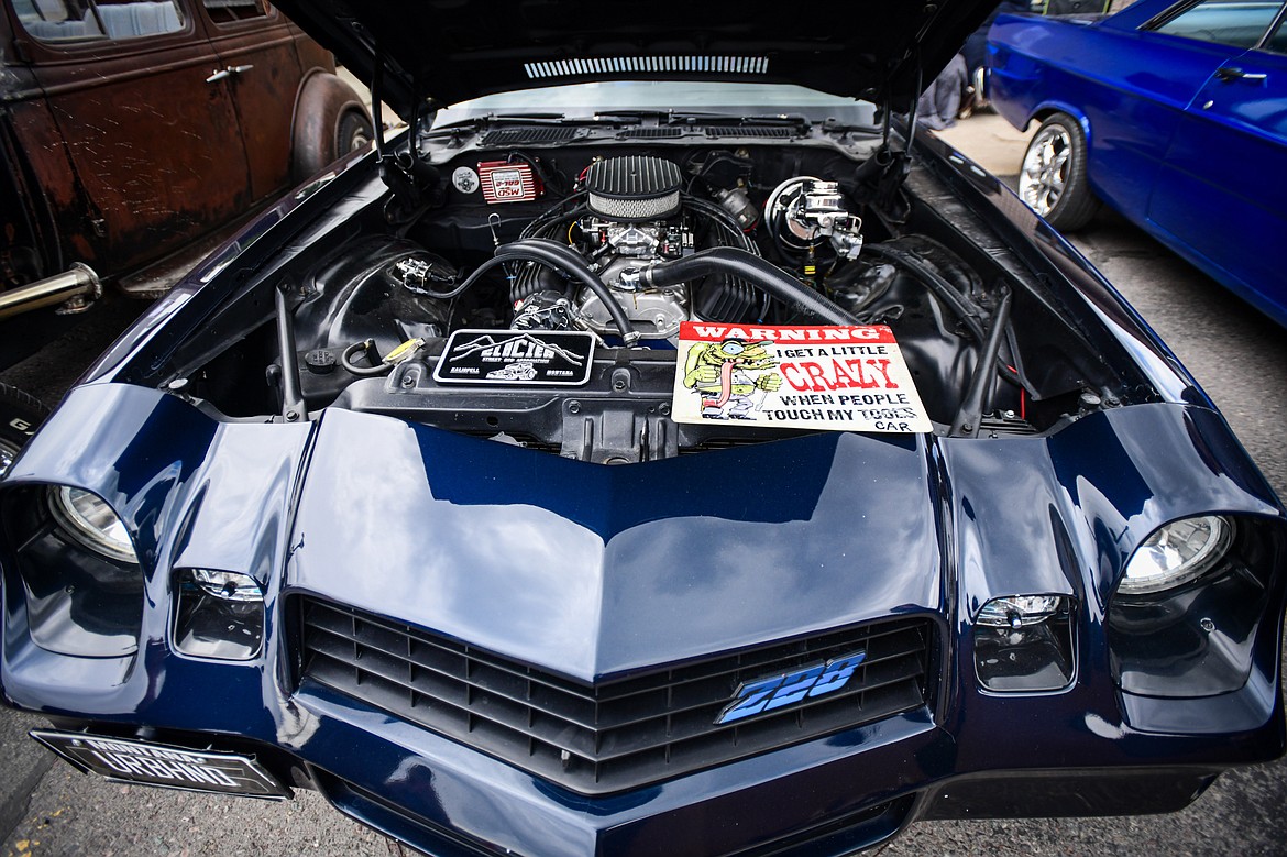 A sign under the hood of a 1978 Chevy Camaro owned by Jim at The Big Shindig in Kalispell on Saturday, June 15. The Big Shindig features a wide range of classic and custom vehicles as well as live music, barbeque, beer and wine and a pin-up polar plunge. Hosted the Glacier Street Rod Association and the Desoto Grill, money raised benefits Mikayla’s Miracles and Blessings Foundation. (Casey Kreider/Daily Inter Lake)