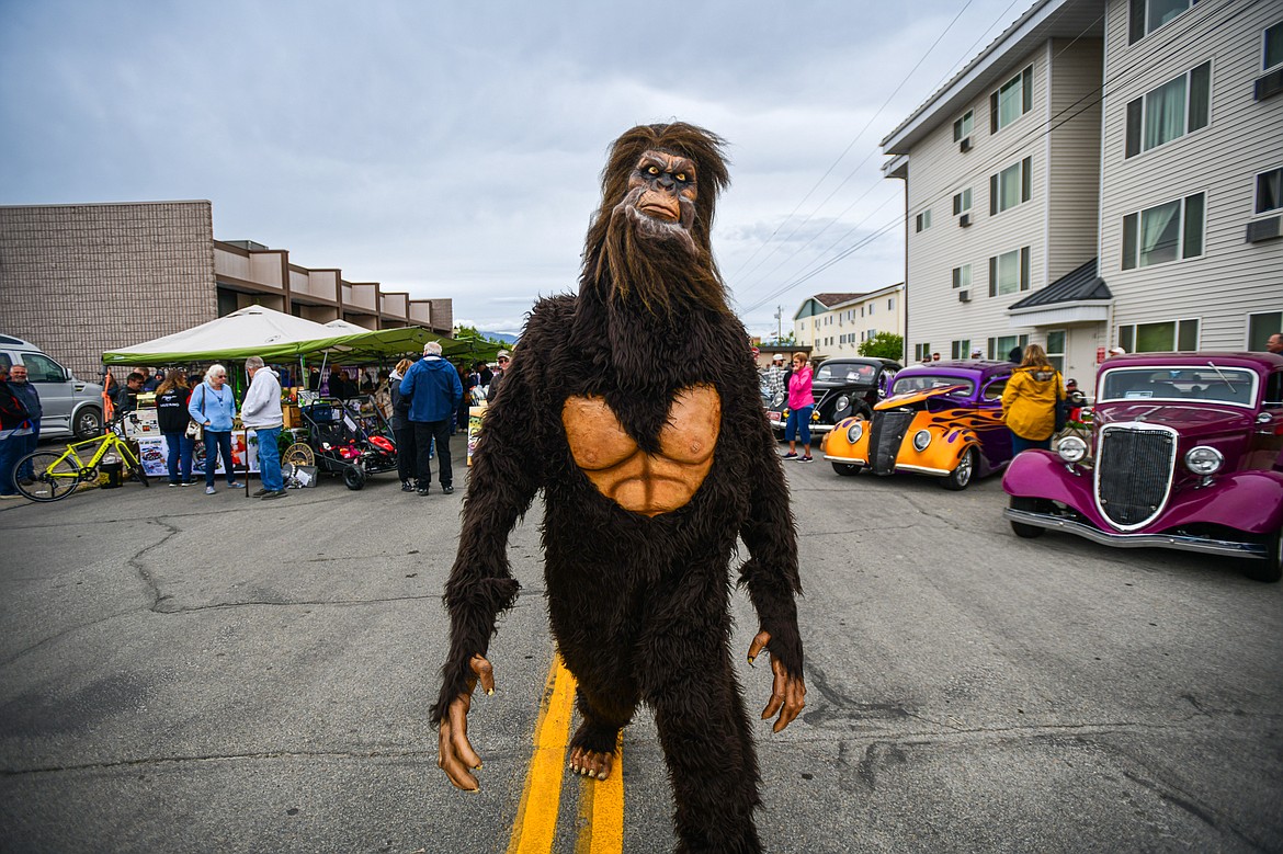 A person dressed in a Bigfoot costume walks through The Big Shindig in Kalispell on Saturday, June 15. The Big Shindig features a wide range of classic and custom vehicles as well as live music, barbeque, beer and wine and a pin-up polar plunge. Hosted the Glacier Street Rod Association and the Desoto Grill, money raised benefits Mikayla’s Miracles and Blessings Foundation. (Casey Kreider/Daily Inter Lake)