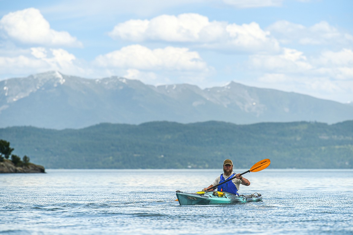 Sea Me Paddle guide Tyler Cohran leads kayakers across Flathead Lake during a tour on Friday, June 14. (Casey Kreider/Daily Inter Lake)