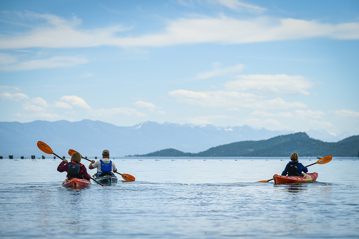 Sea Me Paddle guide Tyler Cohran leads kayakers across Flathead Lake during a tour on Friday, June 14. (Casey Kreider/Daily Inter Lake)