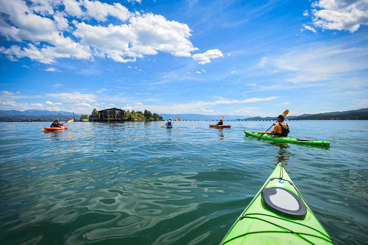 Sea Me Paddle guide Tyler Cohran and co-owner Justin Flake lead kayakers out onto Flathead Lake from Somers Bay during a tour on Friday, June 14. (Casey Kreider/Daily Inter Lake)