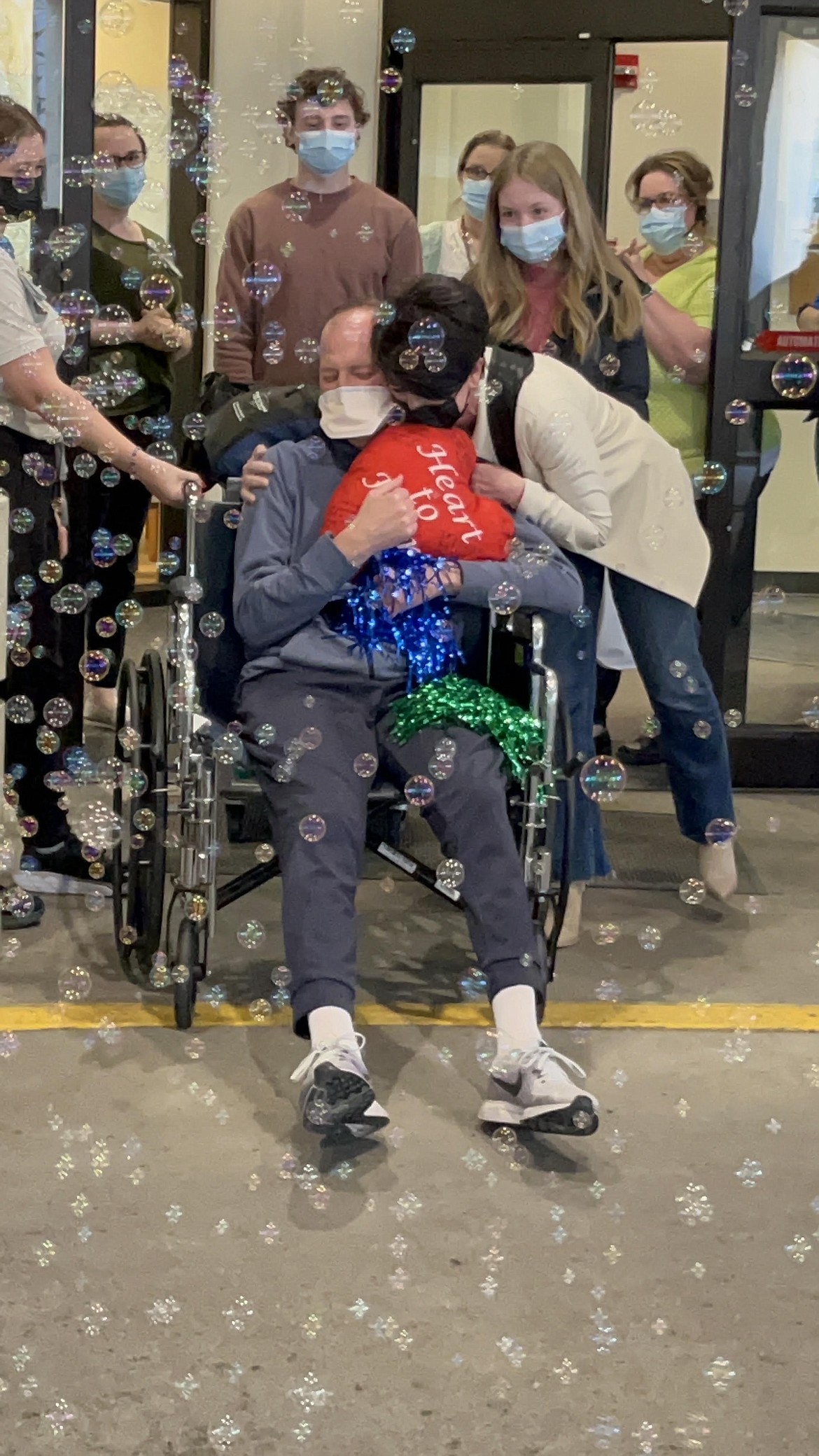 Courtesy photo
Surrounded by family and others, including a hug from wife Nicole, Dan Christ of Coeur d'Alene gets ready to leave Providence Sacred Heart Medical Center in Spokane in March 2023, after receiving a heart transplant.