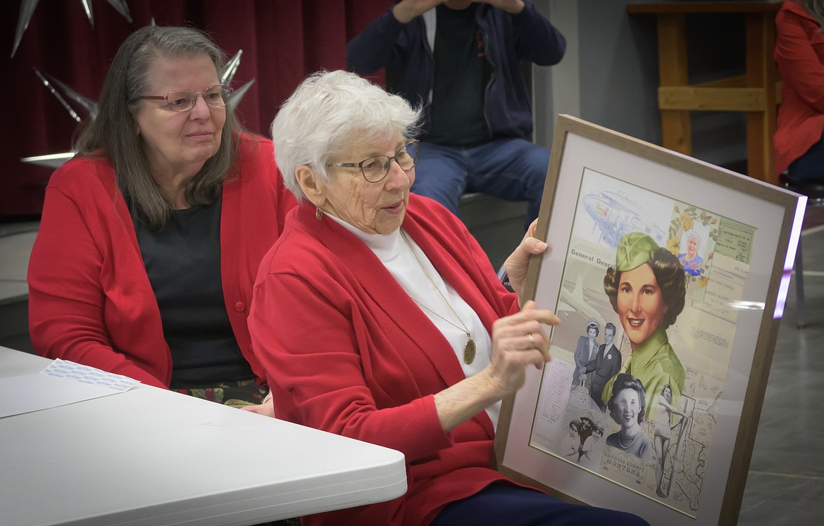 Betty Meyer with a painting of her in uniform during her service in World War II. (Tracy Scott/Valley Press)