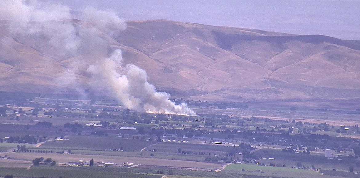 The Beam Road Fire in the Yakima Valley threatened homes and crops Saturday, but by Monday was partially contained and all evacuation notices had been downgraded to level 1.