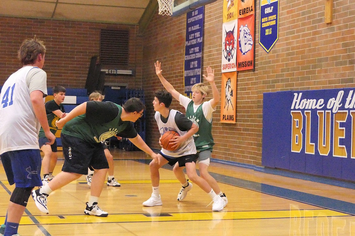 Defense under the basket was on display during the summer league game last week between St. Regis and Thompson Falls, in T Falls.  (Chuck Bandel/VP-MI)