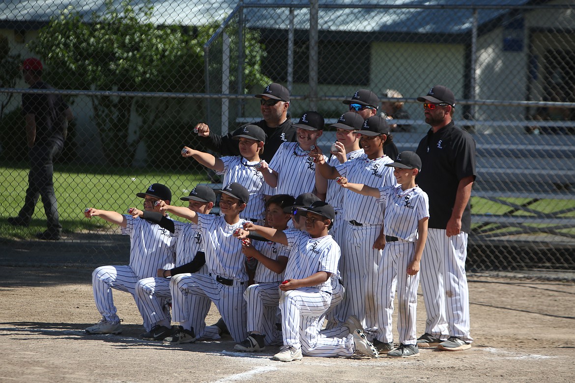 The 10U Central Washington Sixers smile for a photo after defeating the 10U Eastmont All-Stars in the championship game on Sunday.