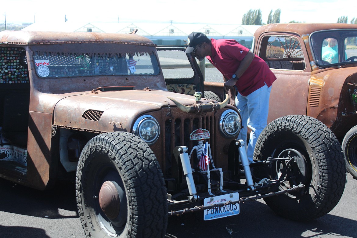 A spectator takes a peek inside a rat rod at the first Brent Reese Memorial car show Saturday.