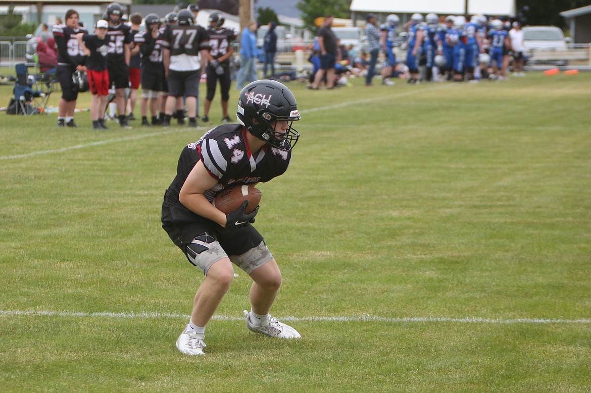 An Almira/Coulee-Hartline receiver catches a touchdown pass during a scrimmage against Wilbur-Creston-Keller on Friday.