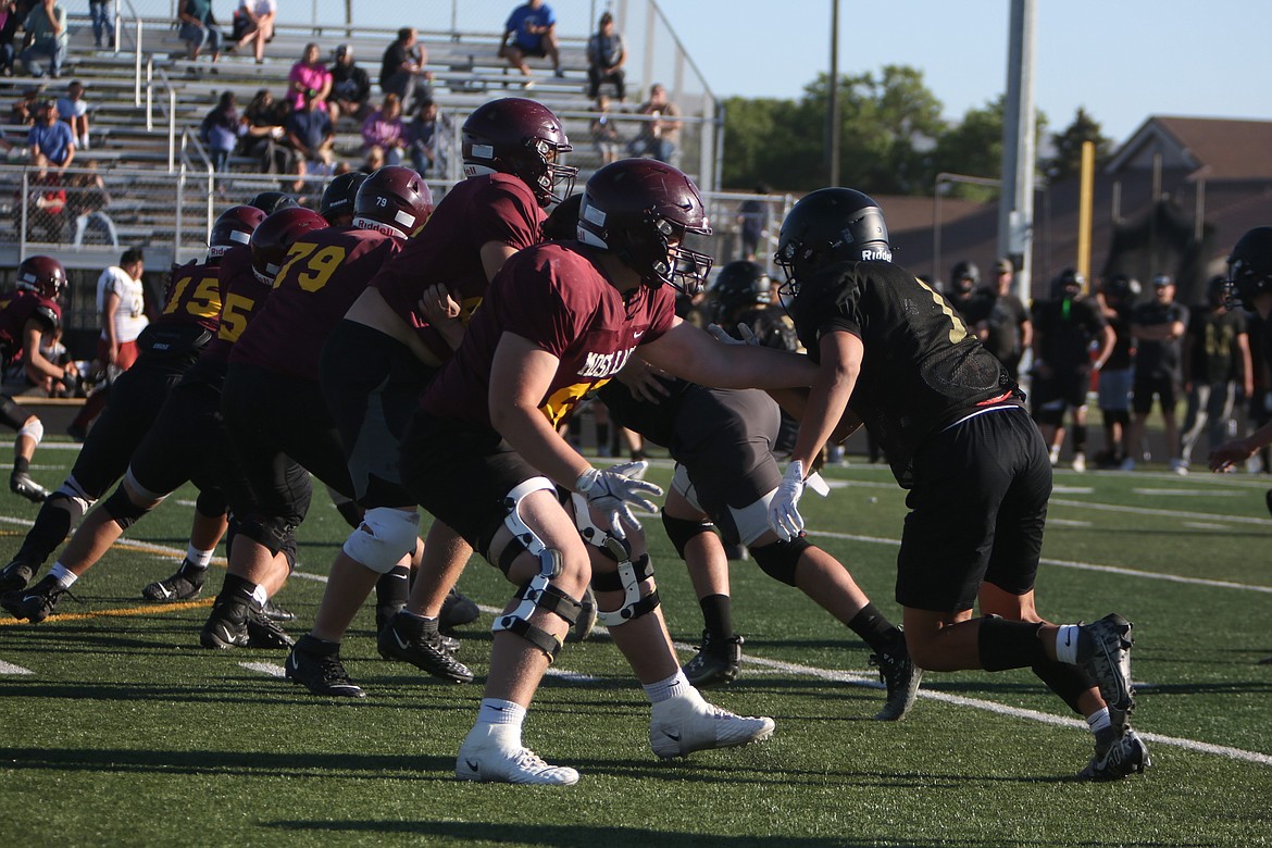 The Moses Lake offensive line drops back into pass protection during a scrimmage against Royal on June 11 in Royal City.