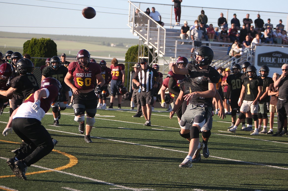 Royal quarterback Lance Allred launches a pass down the field during a scrimmage against Moses Lake on June 11.