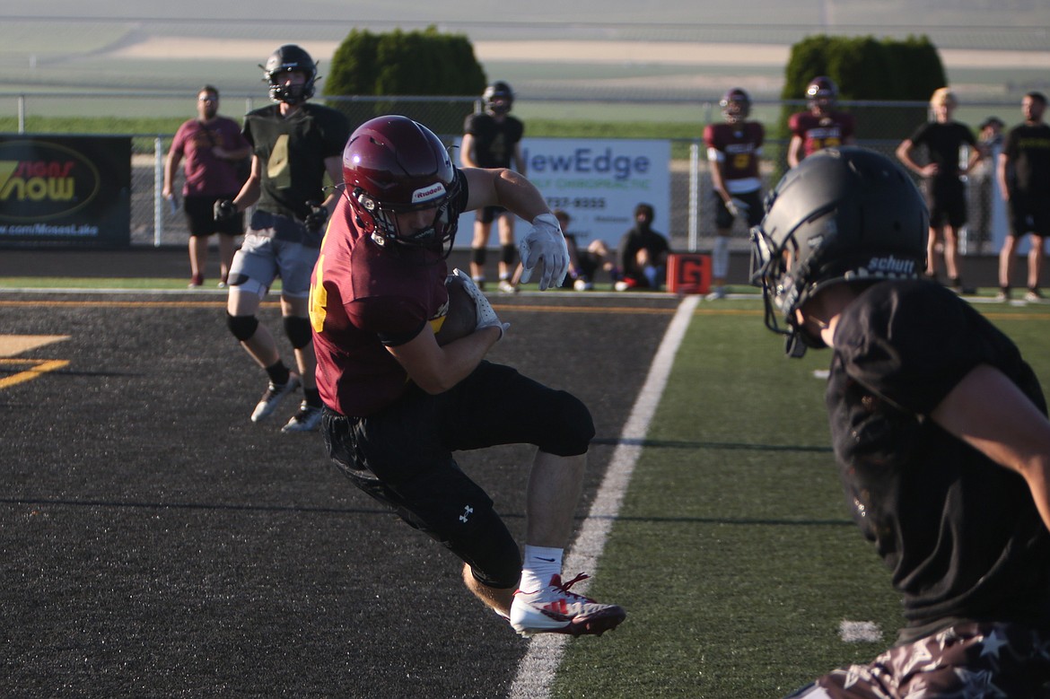 A Moses Lake defensive back comes down with an interception against Royal on June 11.