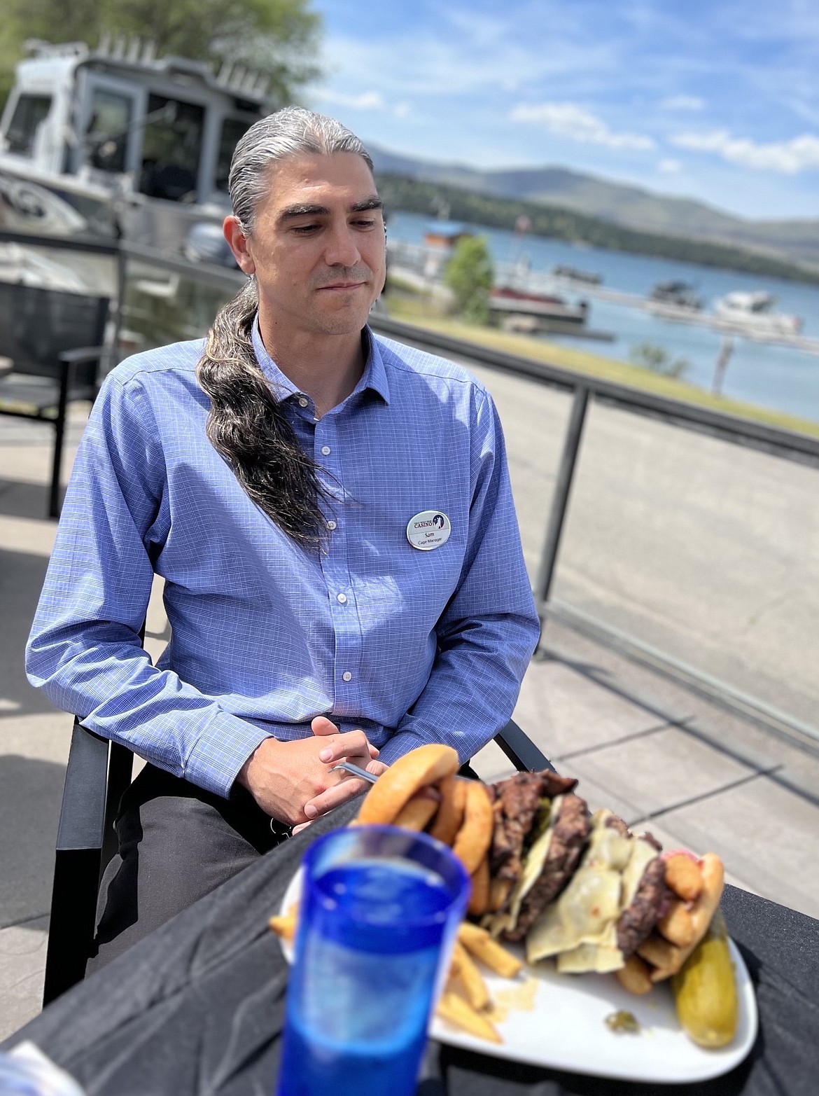 Sam Dempsey contemplates a nearly five-pound burger at the onset of last Friday's Flossie Challenge at Big Arm Resort and Casino. Dempsey took first place, despite leaving 14 ounces on his plate. (Charlene Wells/Leader)