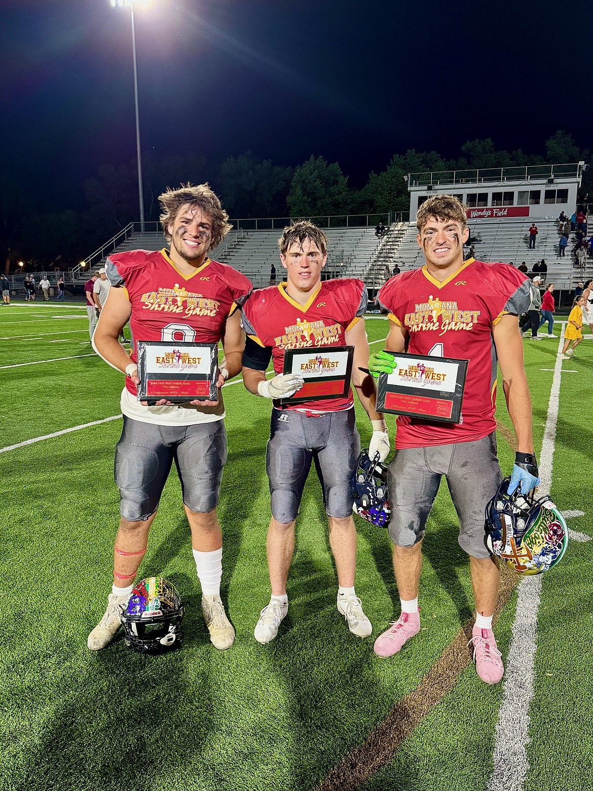 GLACIER WOLFPACK players, from left, Isaac Keim, Kash Goicoechea and Cohen Kastelitz pose with their Shrine Game MVP trophies. (photo courtesy of Rhonda Kastelitz)