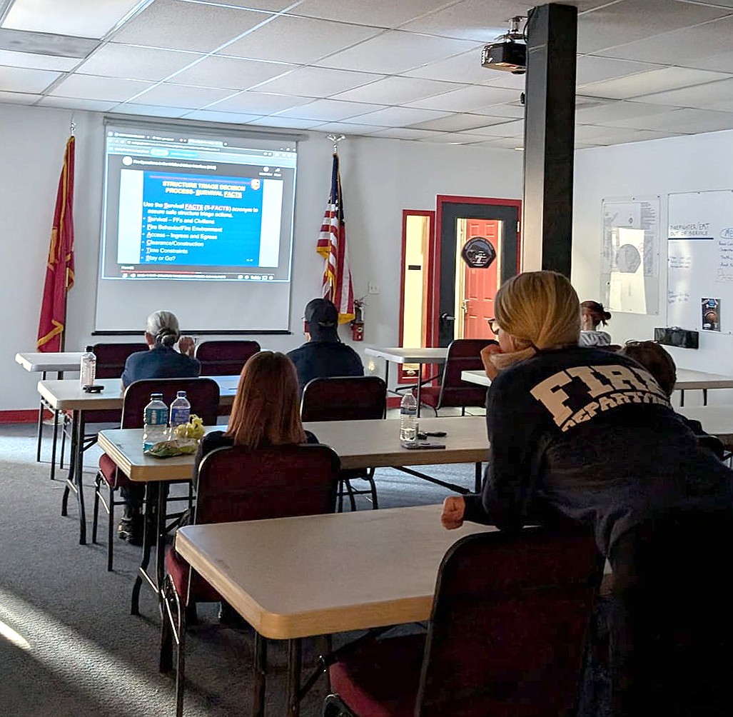 Volunteers and career firefighters with Grant County Fire District 7 continue their training Monday in wildland-urban interface structure defense.