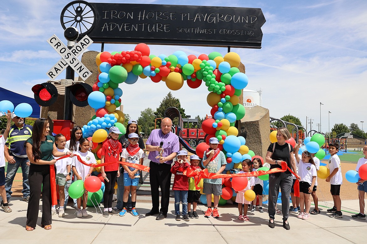 Othello Mayor Shawn Logan and a crew of helpers cut the ribbon on the new Iron Horse Playground Friday.