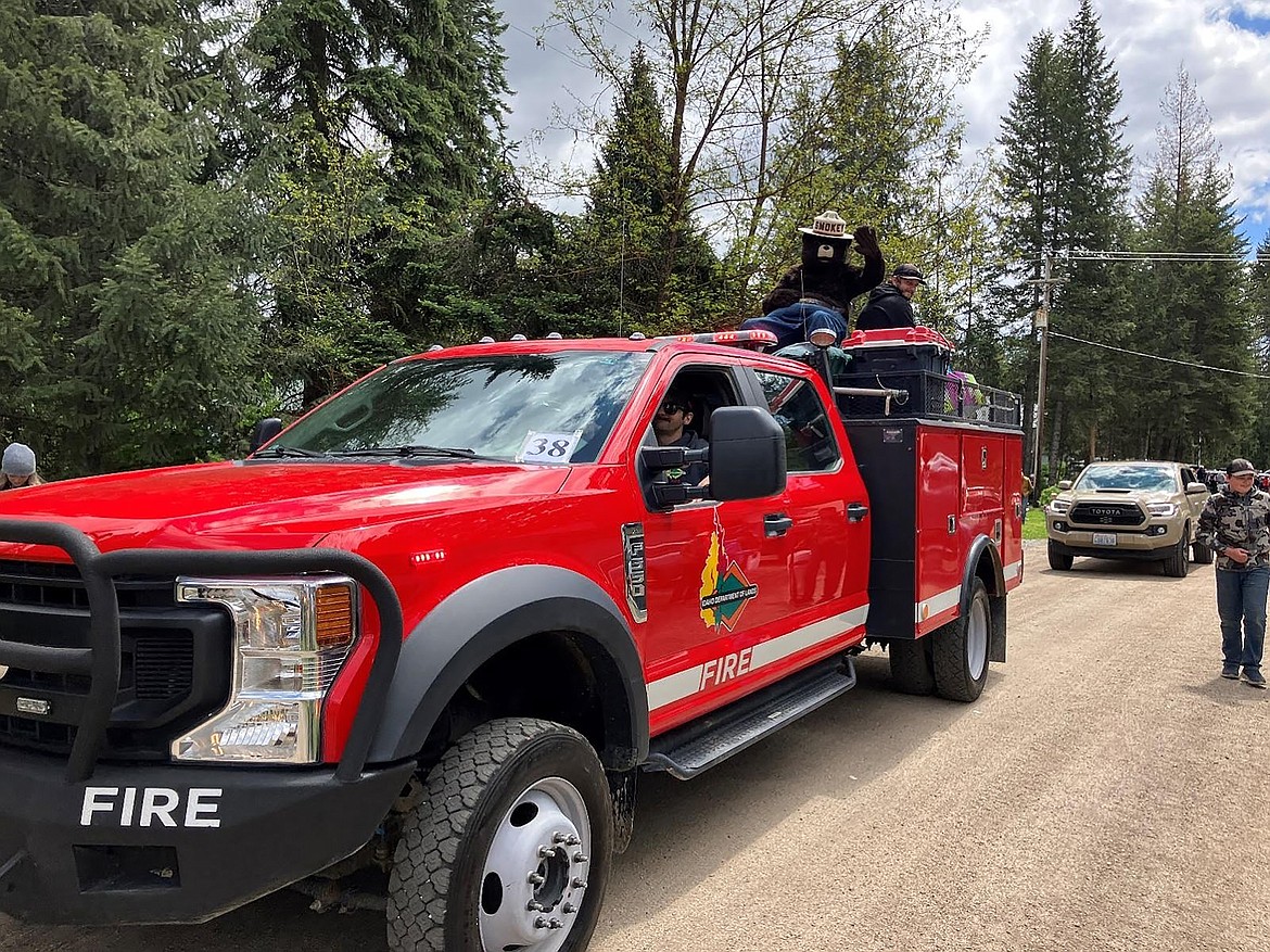 Smokey rides in an Idaho Department of Lands truck during the Coolin parade on May 25. The ride was an early celebration of his upcoming 80th birthday.