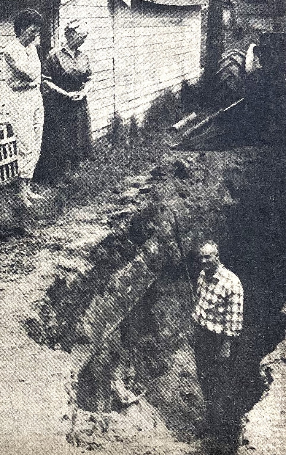 Tootie James stands in the ditch where he rescued a buried man. Betty Leonard, top left, and her mother, Inga Lien, helped in the rescue.