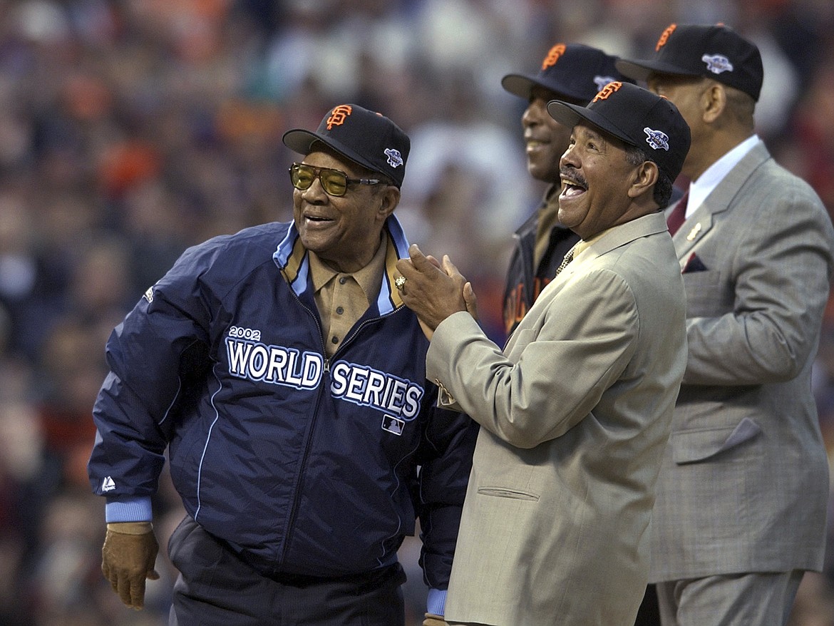 Willie Mays, left, is joined by former San Francisco Giants' Orlando Cepeda, right, Willie McCovey and Juan Marichal, front, before Game 3 of the World Series between the Giants and the Anaheim Angels in San Francisco,Oct. 22, 2002. Mays, the electrifying “Say Hey Kid” whose singular combination of talent, drive and exuberance made him one of baseball’s greatest and most beloved players, has died. He was 93. Mays' family and the San Francisco Giants jointly announced Tuesday night, June 18, 2024, he had “passed away peacefully” Tuesday afternoon surrounded by loved ones. (AP Photo/Kevork Djansezian, File)