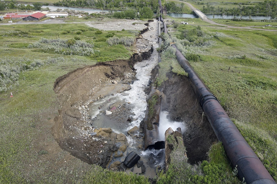 This photo released by the Bureau of Reclamation Missouri Basin Region, Montana Area Office, shows a breach in the St. Mary Canal siphon in Babb, Montana, Monday, June 17, 2024. The siphon is part of a system that carries water from a river on the Blackfeet Indian Reservation to another river that provides irrigation water to farmers and drinking water to 14,000 residents in northern Montana. No injuries or deaths have been reported since the century-old pipes broke open Monday. Officials do not know how long it will take to repair the damage. (Bureau of Reclamation Missouri Basin Region, Montana Area Office via AP)