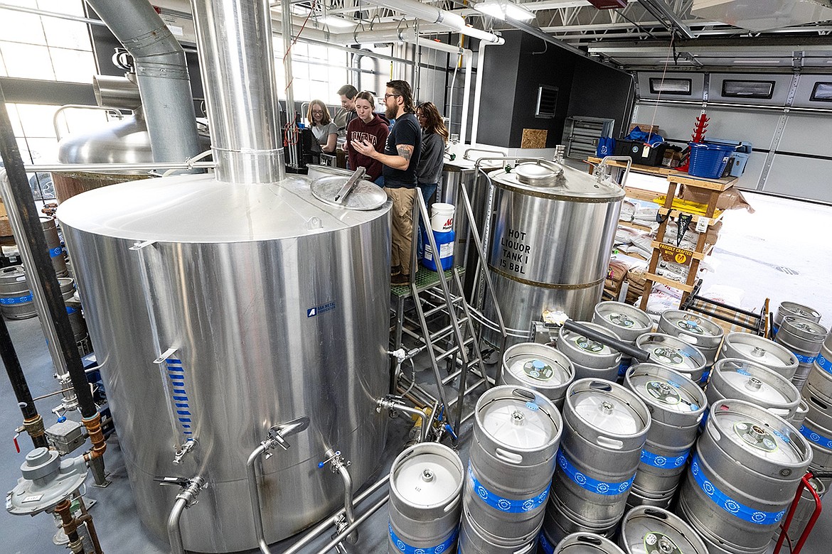 Early in their studies, students enrolled in the University of Monana’s brewing science class toured Conflux Taphouse with Head Brewer Derek Fassino. (UM photos by Ryan Brennecke)