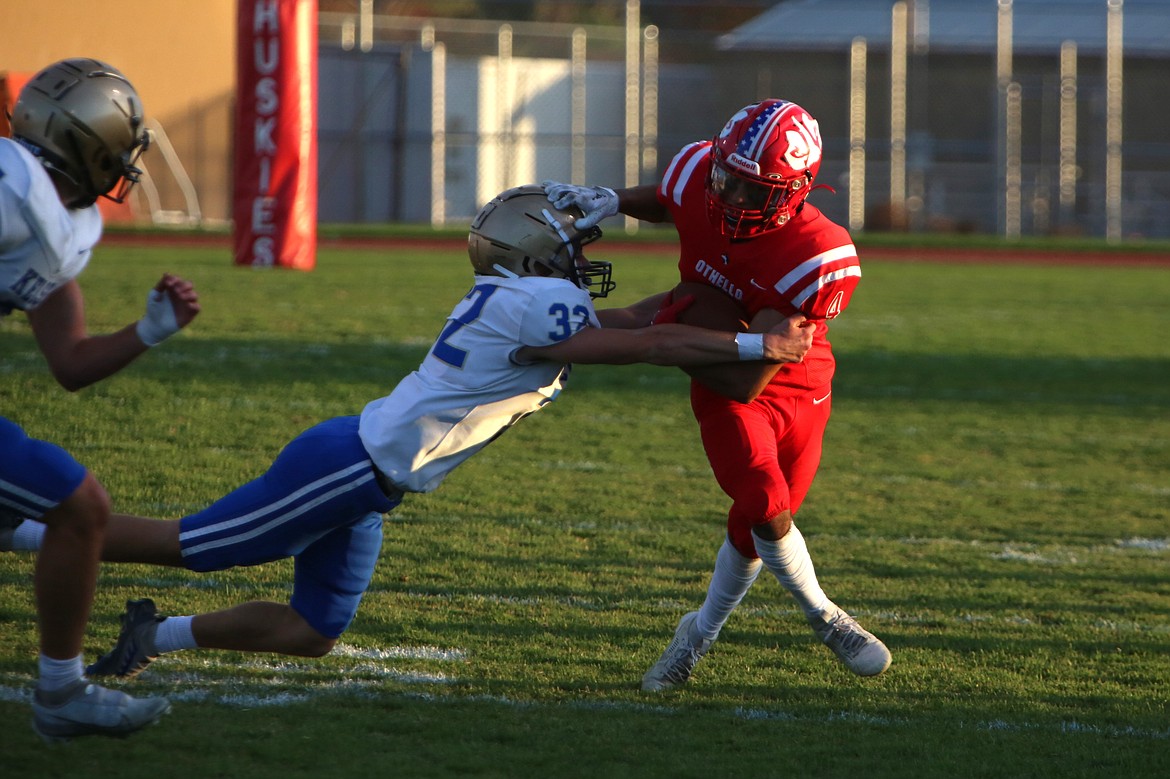 Othello graduate Alex Mendez (4) stiff-arms a Kelso defender during a game in the 2023 football season. Mendez is one of four Columbia Basin football players playing in Saturday’s Earl Barden Classic.