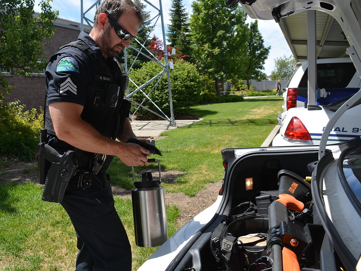 Sgt. Ryan Dalke checks the gear in his police vehicle Thursday at Post Falls Police Department.