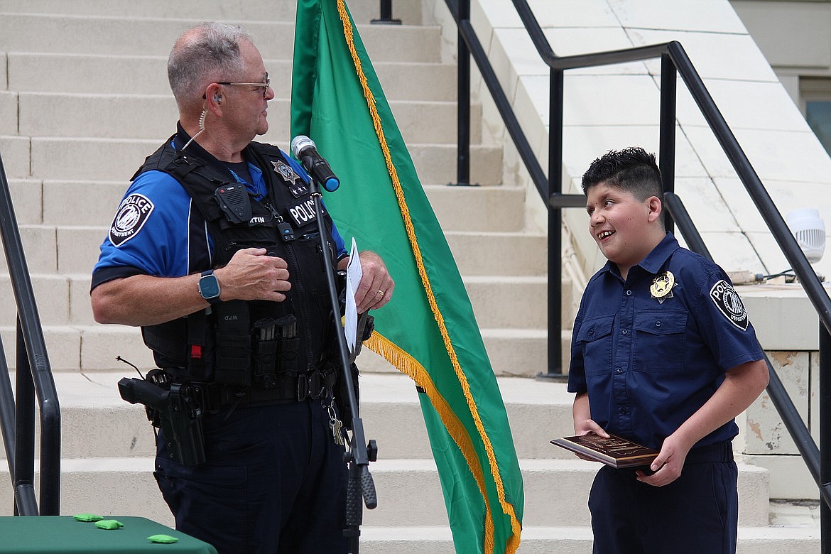 Warden Police Chief for a Day Gregorio Acero has a smile for Warden PD Chief Rick Martin. The Chief for a Day event, held June 6, allows children to connect with law enforcement officers and other first responders and learn more about the work they do. For the first responders, it’s an opportunity to visit with young community members and a fun event in general.