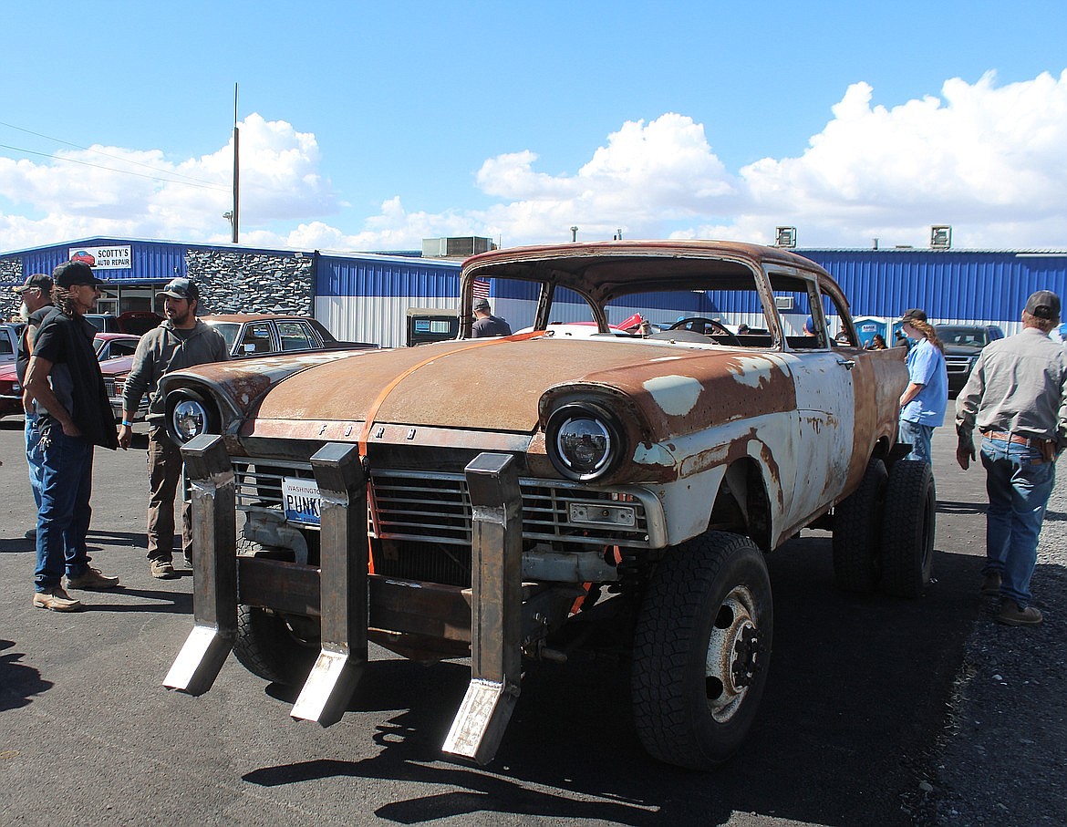 Chuckie Koepke, second from left, who built the Frankencar shown here, talks with a spectator at the Brent Reese Memorial car show. The car show raised about $4,000 to help fight Lou Gehrig’s Disease on June 15.