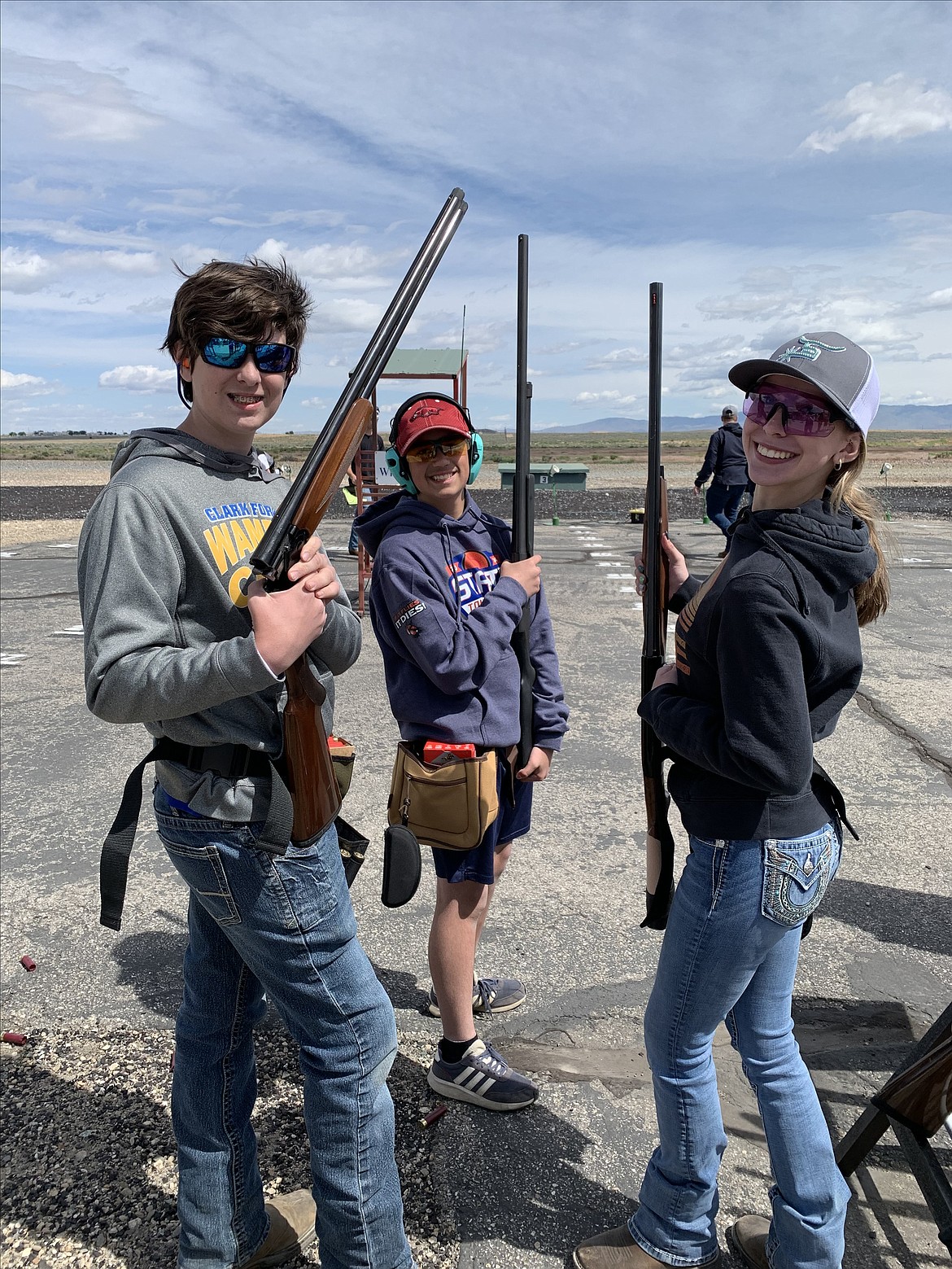 From left, Kyler Heilman, Breckham Noble and Rebecca Heilman get ready to toe the line at the Idaho State Trap Shooting Tournament.