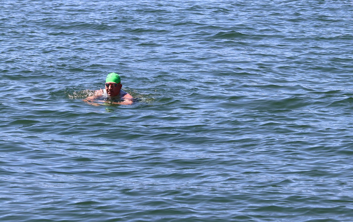 Mack Babcock makes his way back to Independence Point after taking a swim in Lake Coeur d'Alene on Friday.