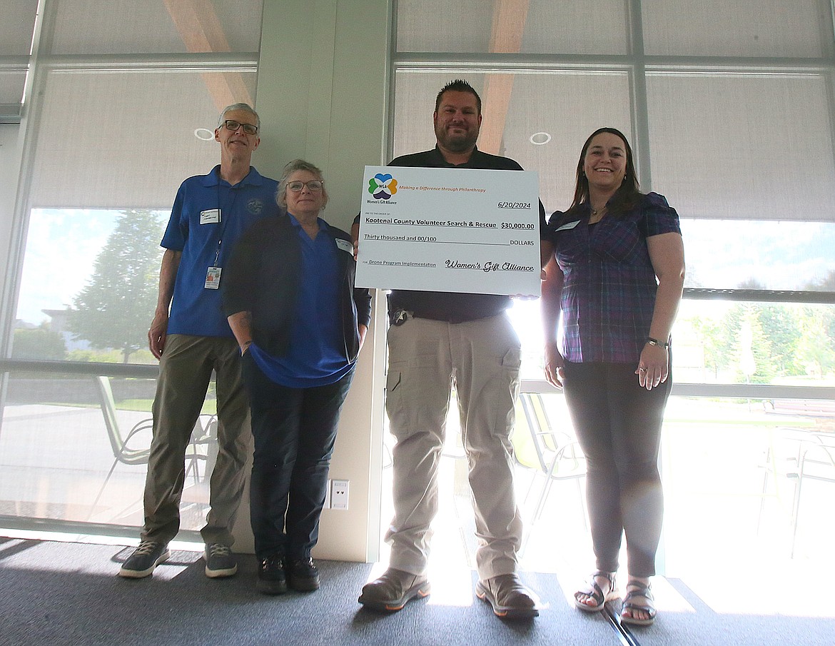 Kootenai County Volunteer Search and Rescue was awarded $30,000 Thursday evening during the Women's Gift Alliance's grant awards celebration. From left: Mark Stambaugh, Teck Gotreau, Kootenai County Sheriff's Office Deputy Adam Zitterkopf and Astra Vaughan.