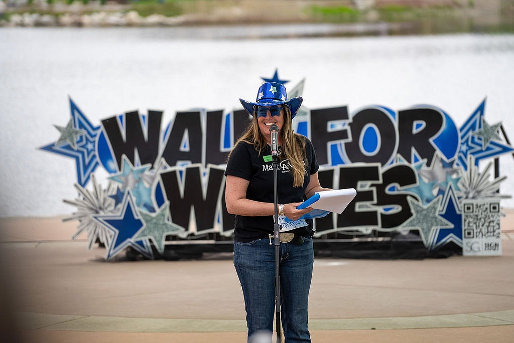 Michelle John, regional manager for Make-A-Wish Idaho, makes an announcement June 1 at the inaugural Walk for Wishes North Idaho at Riverstone Park.
