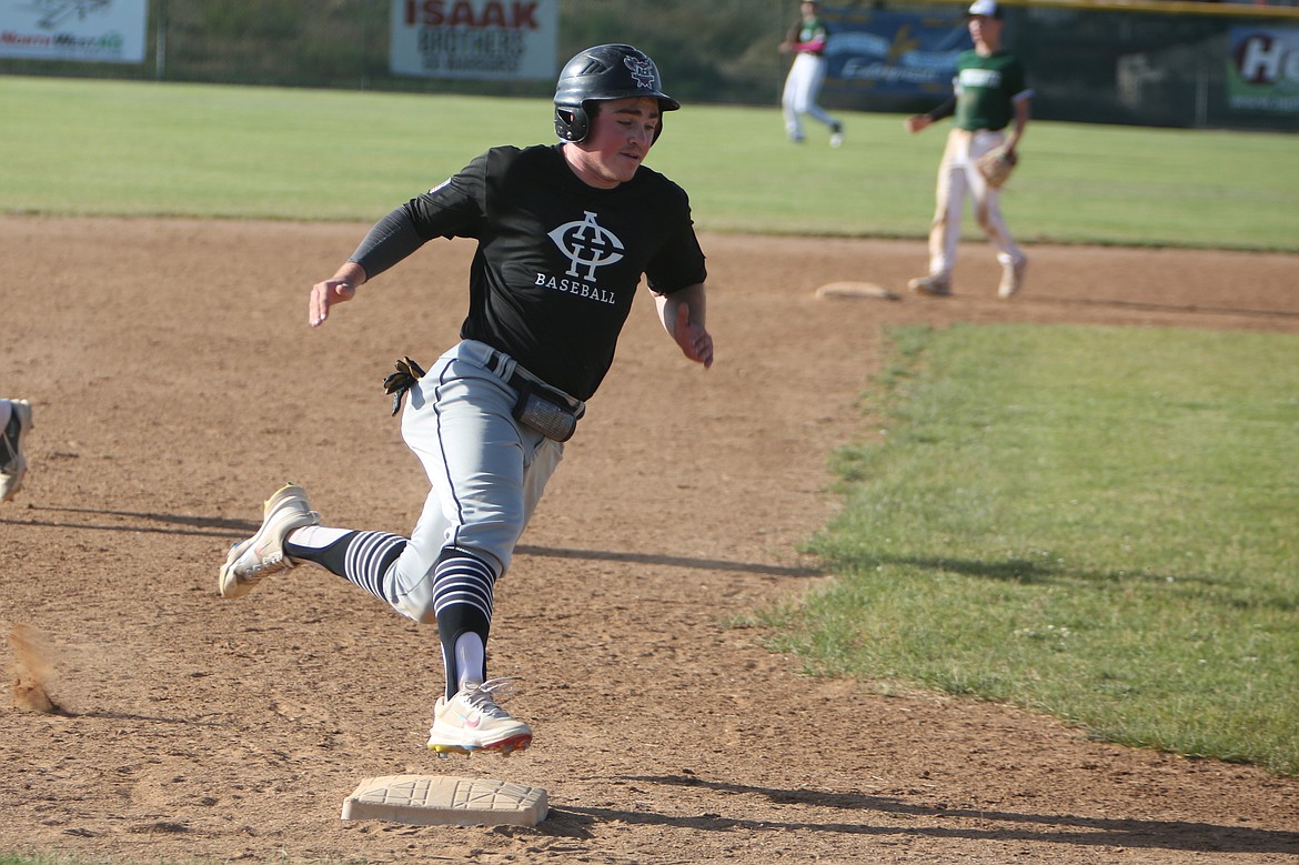 Almira/Coulee-Hartline Legion third baseman Carter Pitts rounds third base in Friday’s night game against East Valley.