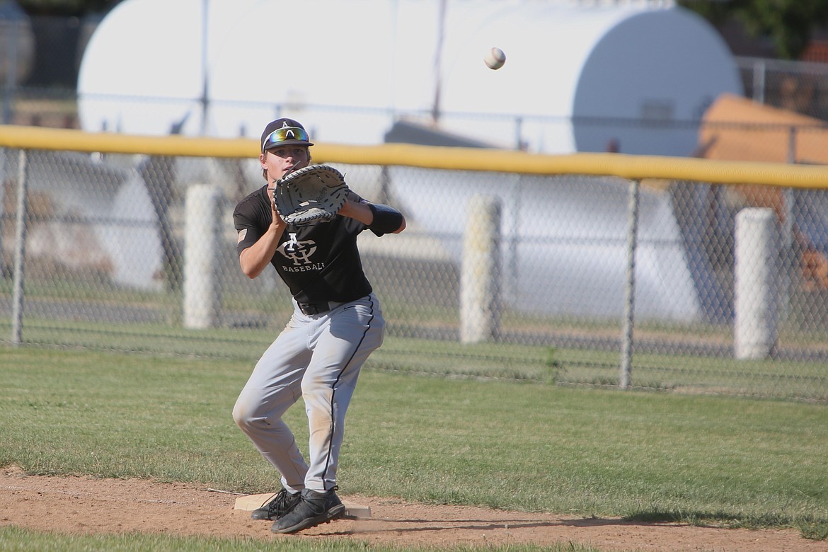 Almira/Coulee-Hartline Legion first baseman Josh Booker catches a thrown ball for an out against East Valley on Friday.