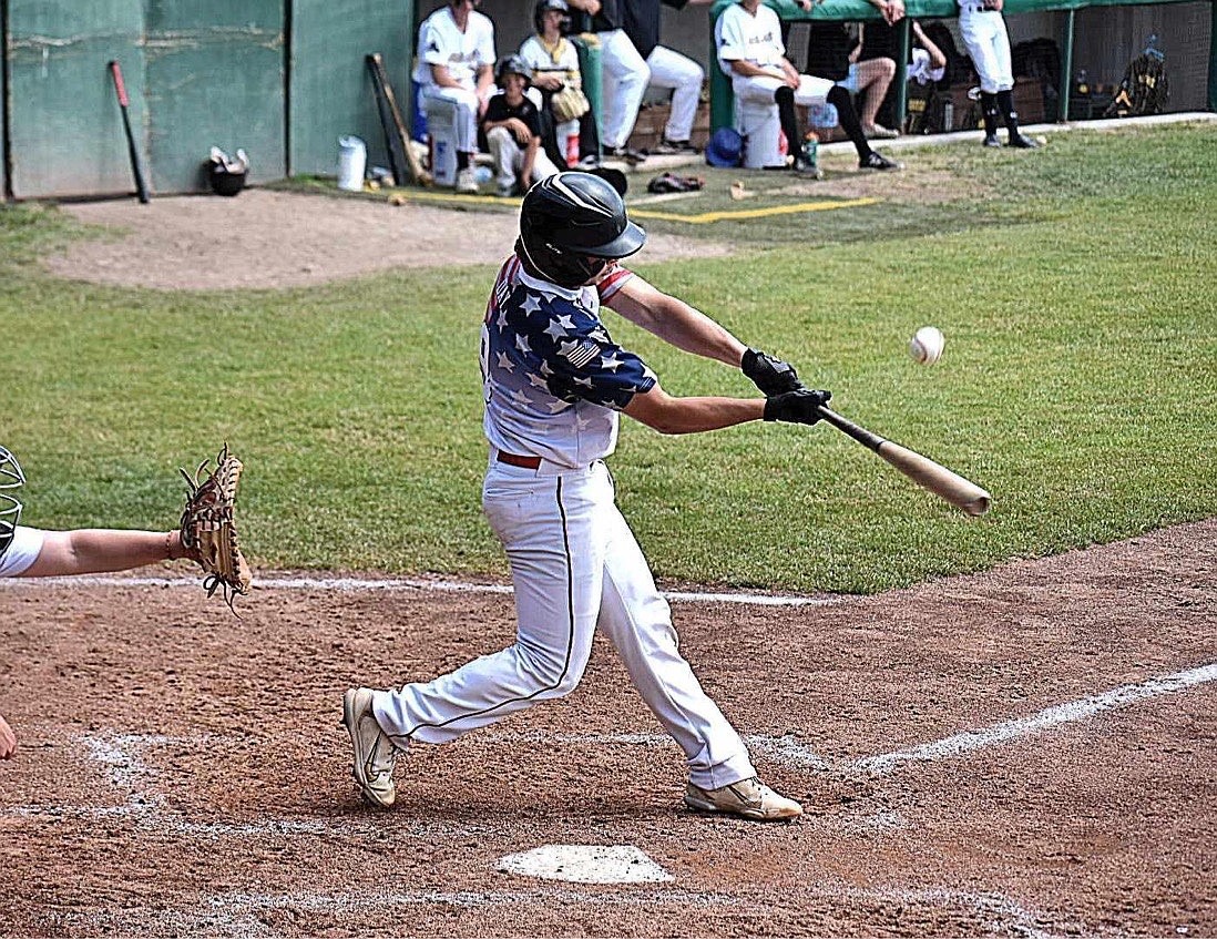 Gavin Day drives a ball to deep center field for a double during the top of the seventh inning on Saturday.