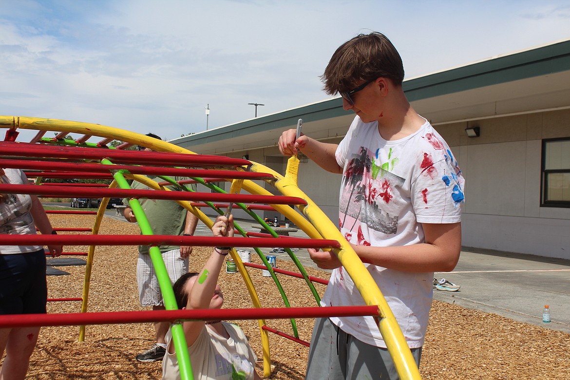 Twenty students from the youth group at the CitiPoint Church in Mt. Vernon volunteered to come to Moses Lake and work for the Light of Larson Church on a variety of jobs, among them painting playground equipment.