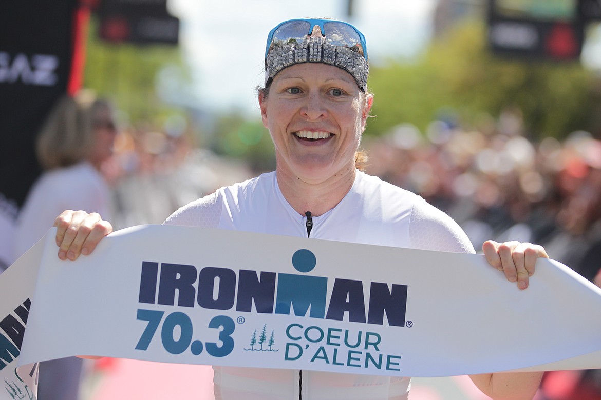 JASON ELLIOTT/Press
Karrie Stewart of Seattle celebrates after finishing as the top female in Sunday's Ironman 70.3 Coeur d'Alene in 4 hours, 21 minutes and 28 seconds.