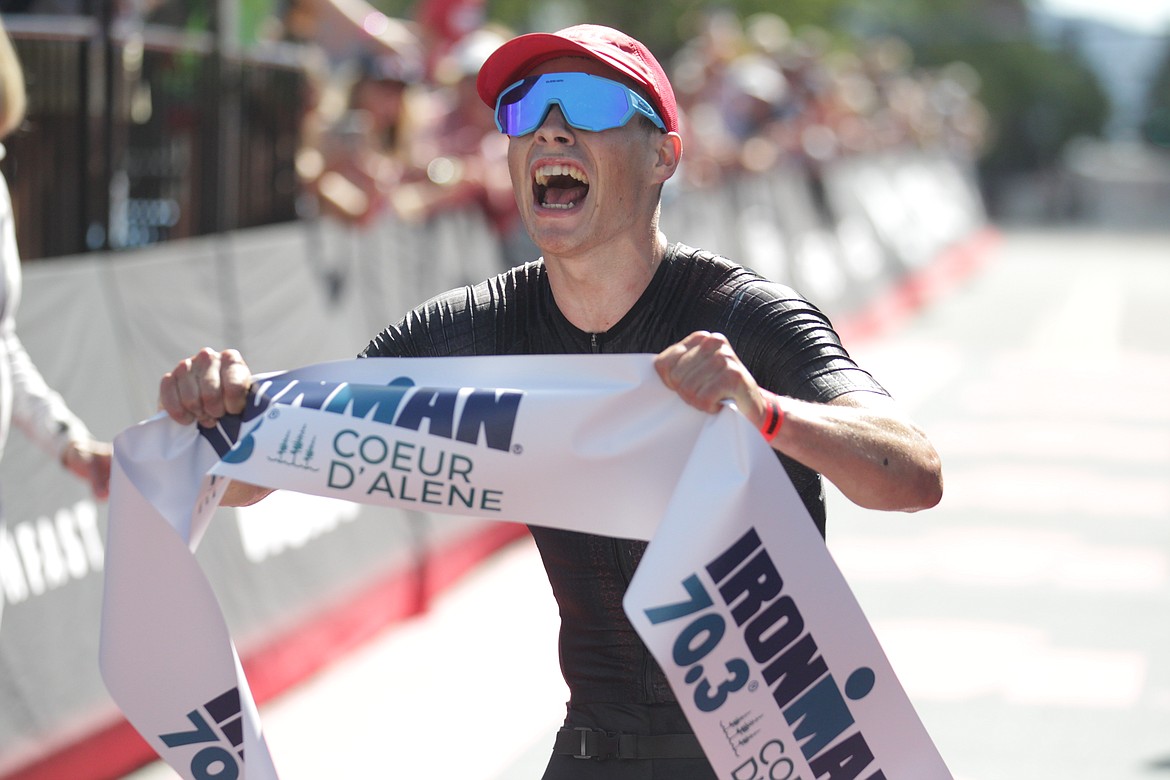 JASON ELLIOTT/Press
Zachary Bernier-Michaud of Kelowna, British Columbia, celebrates after winning Sunday's Ironman 70.3 Coeur d'Alene. Bernier-Michaud, who was sixth in the full race in 2023 in Coeur d'Alene, won in 3 hours, 36 minutes and 32 seconds.